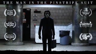 The Man in the Pinstripe Suit
