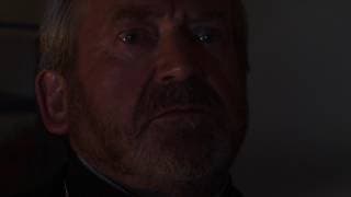 Terry Palmer as Father Danes in Fight the Eternal Evil